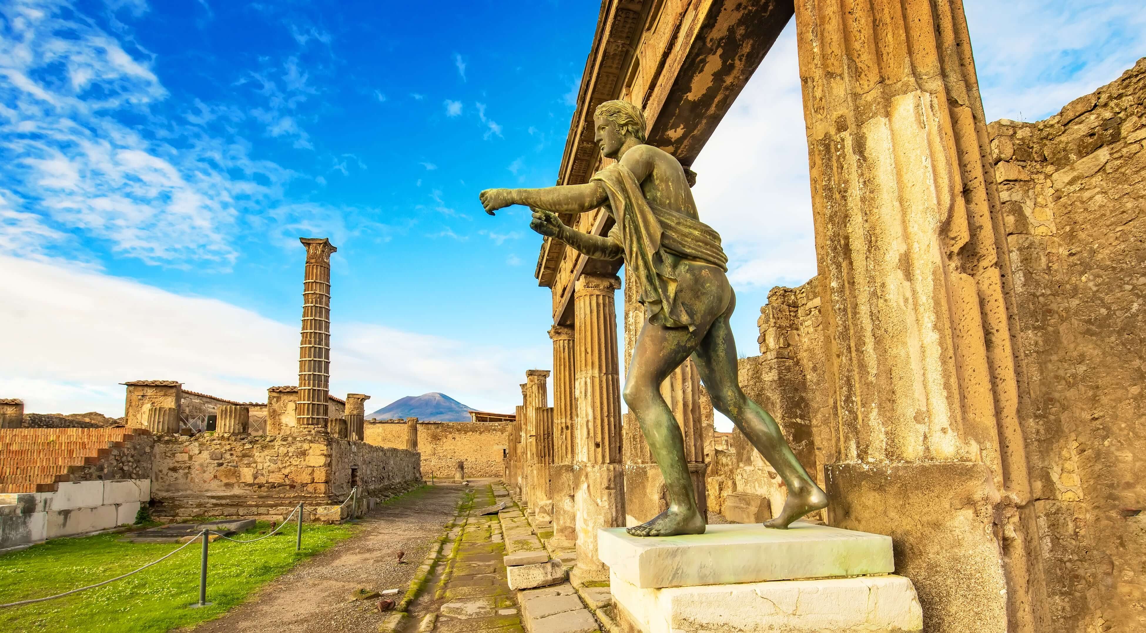 Ancient Pompei city skyline and bronze Apollo statue, Italy